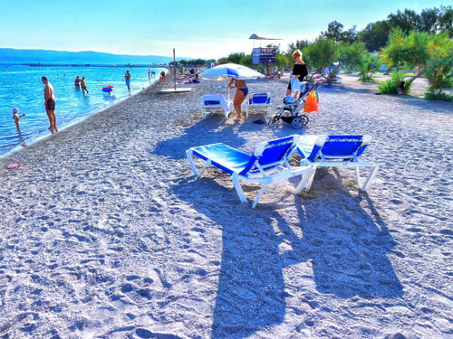 Beautiful white sand on the main beach in town Omis